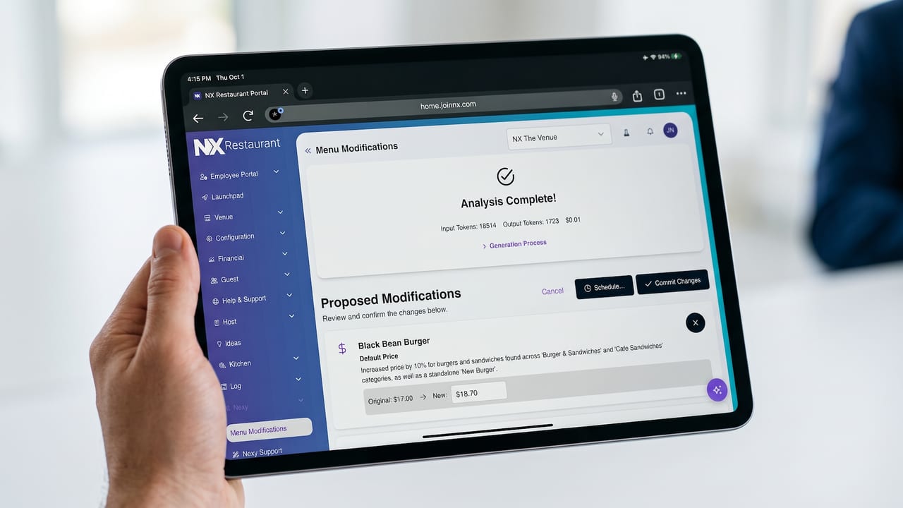 Manager holding an iPad showing Nexy's proposed price changes in the NX portal, ready to commit.